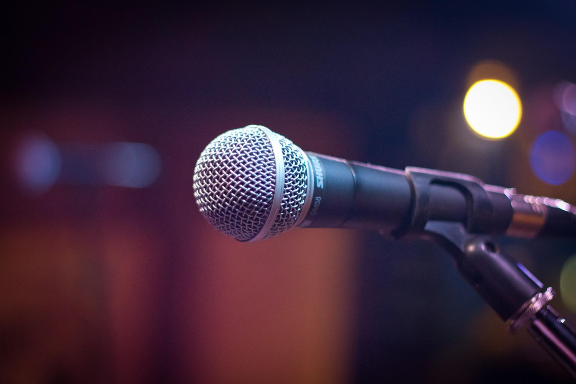 A microphone with a blurry background.