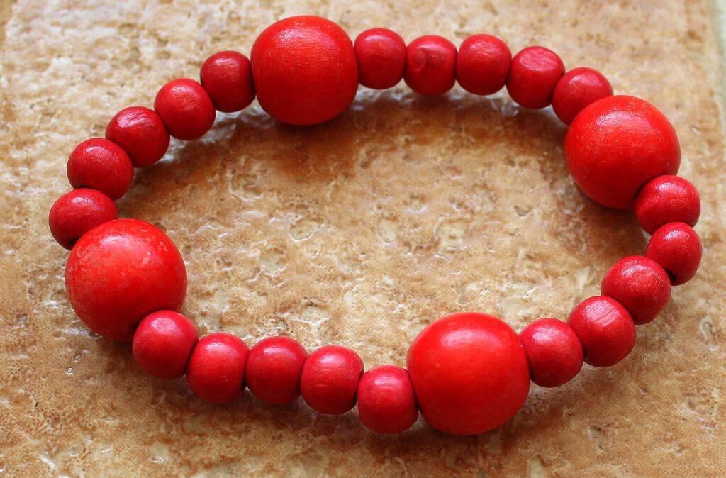 Bright red beaded bracelet.