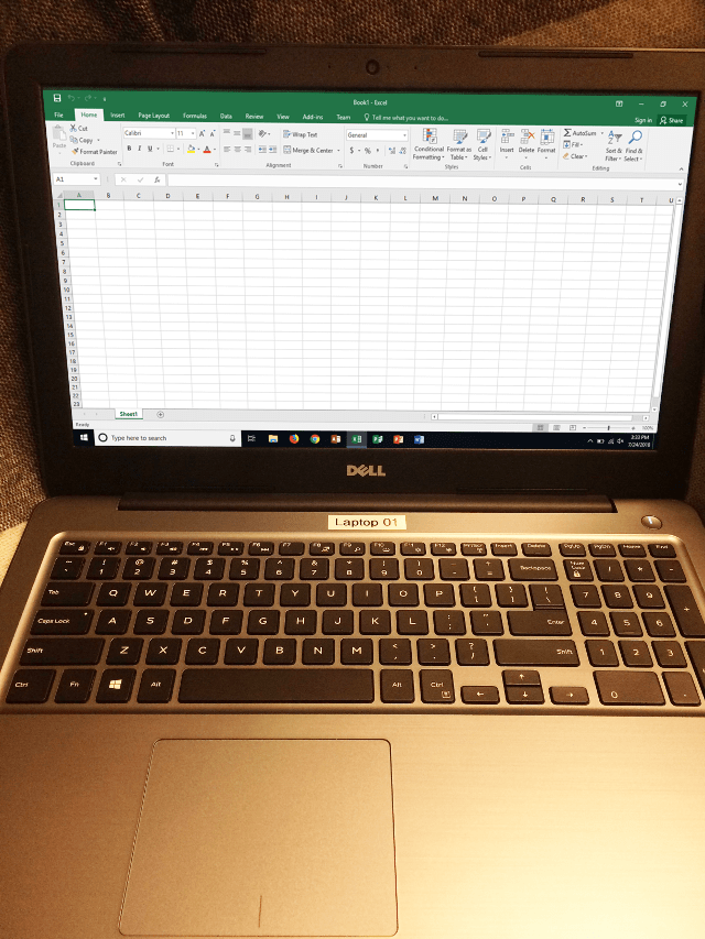 Laptop running Microsoft Excel 2016.