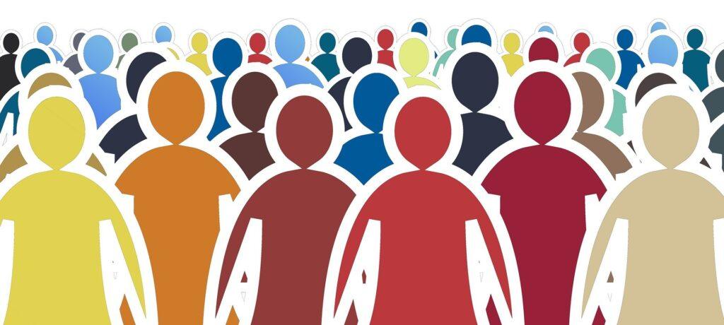 Colorful silhouettes of people standing together, symbolizing community and diversity.