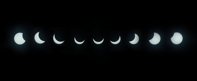 Phases of a solar eclipse shown in a series, from partial to full coverage, on a black background.