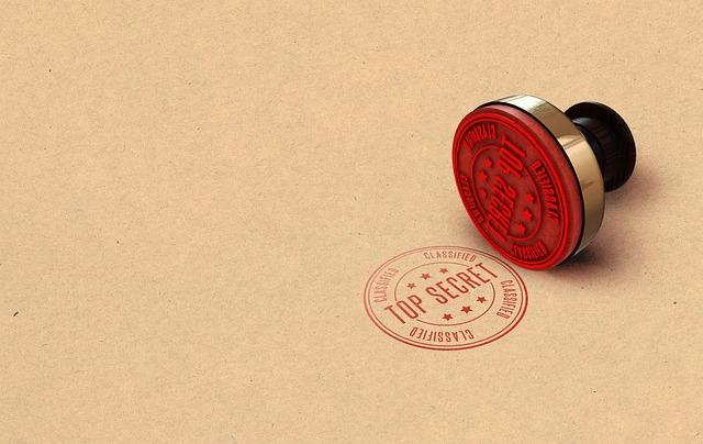 Red "Top Secret" stamp on brown paper, labeled with "Classified" in a circle.
