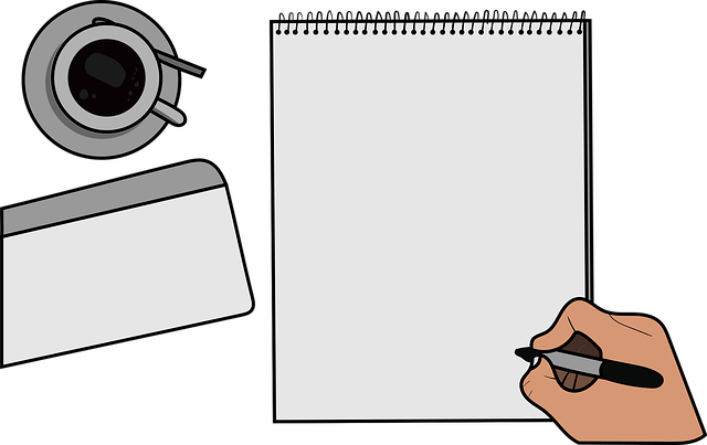 Hand writing on a blank notepad, with a cup of coffee nearby on a table.