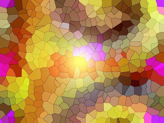 Colorful mosaic pattern with bright yellows, pinks, and browns forming an abstract, stained-glass effect.