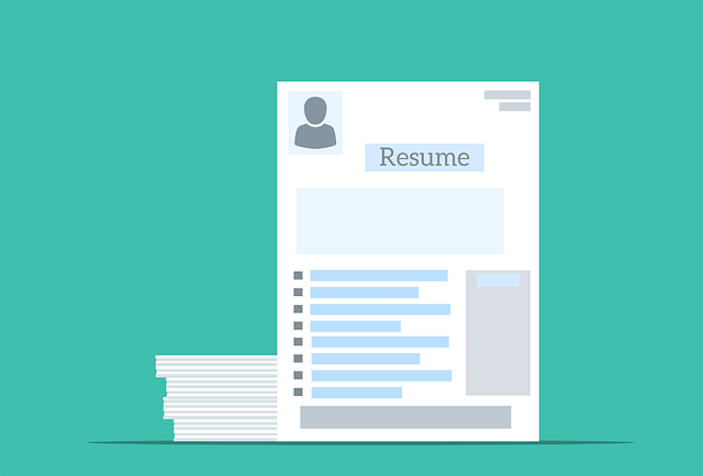 Resume template with profile icon, placed beside a stack of papers on a turquoise background.